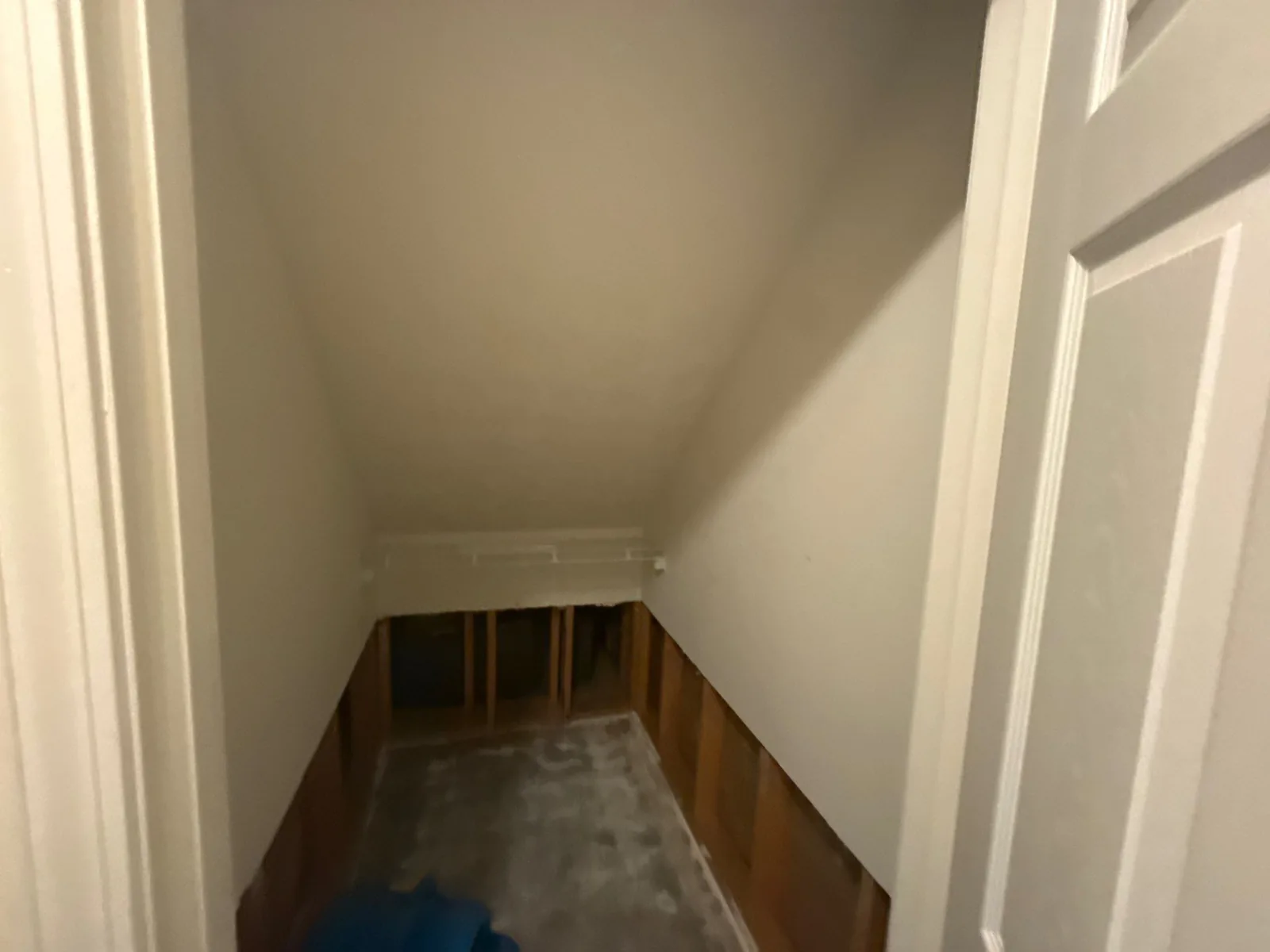 A room with exposed wall studs and flooring, indicating ongoing water restoration work — serving Dallas, GA.