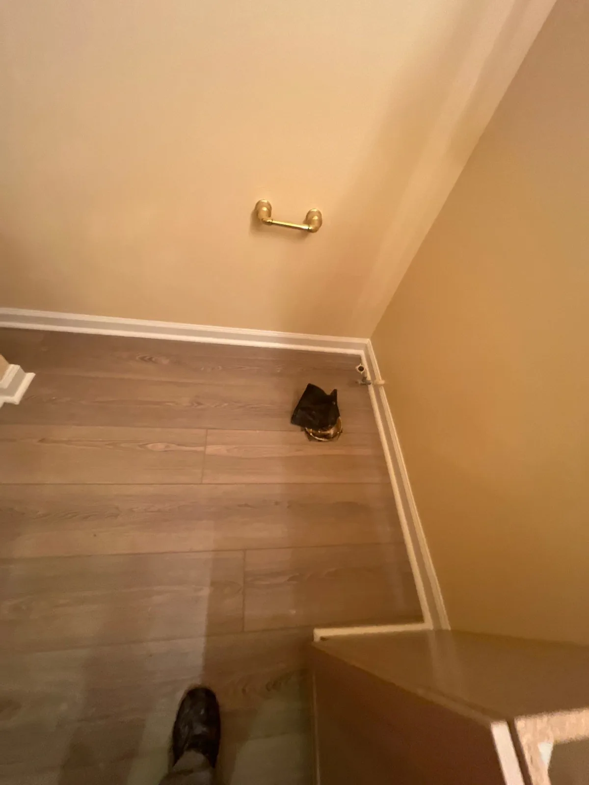 Room with newly installed flooring and a towel bar on the wall during remodeling — serving Dallas, GA.