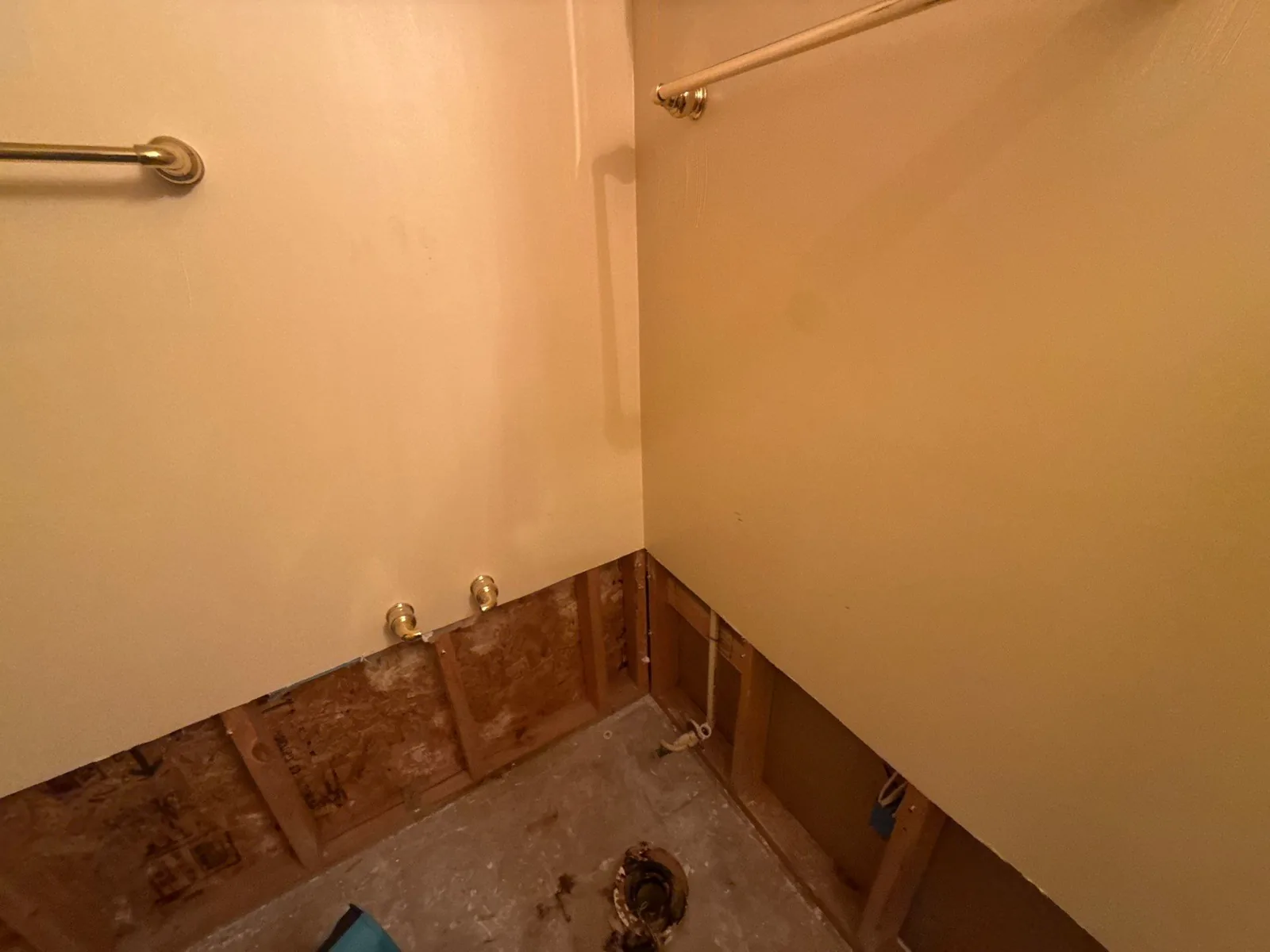 Unfinished bathroom with exposed studs and plumbing, indicating early remodeling phase — serving Dallas, GA.