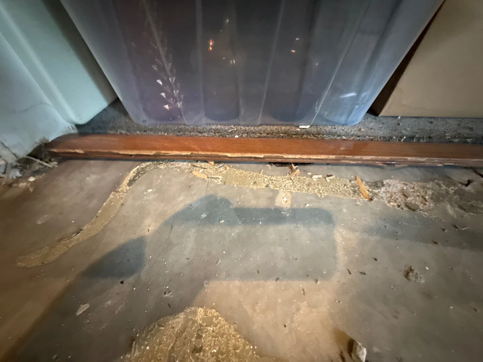 Damaged floor area with exposed subflooring and debris, requiring restoration — serving Dallas, GA.