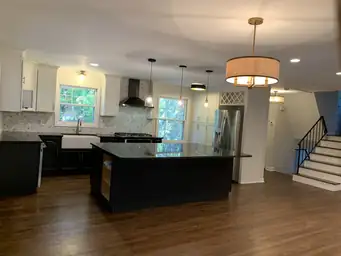 Kitchen remodel with two-tone shaker cabinets, marble hexagon mosaic backsplash, and wood plank ceiling — Metro Atlanta, GA