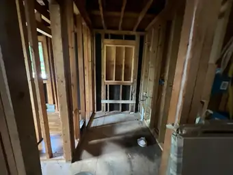Finished bedroom with light hickory hardwood floors and white walls and trim ready for final inspection after home remodel — Marietta, GA