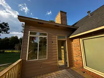 Sunroom addition drywall installation with coffered ceiling framing, compound-mudded joints, and scaffold staging in place — Marietta, GA