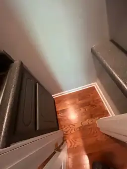Corner of a room with newly finished hardwood flooring and dark countertops, indicating a completed remodeling phase — serving Dallas, GA.