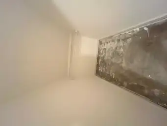 Room under construction showing a partially plastered ceiling edge — serving Dallas, GA.