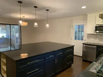 Open kitchen layout renovation with dark upper cabinets, white lower cabinets, and hexagon marble backsplash — Metro Atlanta, GA