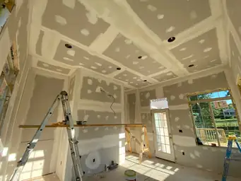 Coffered tray ceiling drywall framing with exposed electrical wiring stub and recessed light cans during sunroom build — Marietta, GA